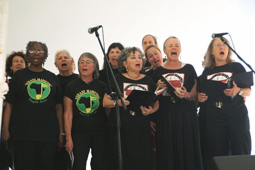 Chorus members singing